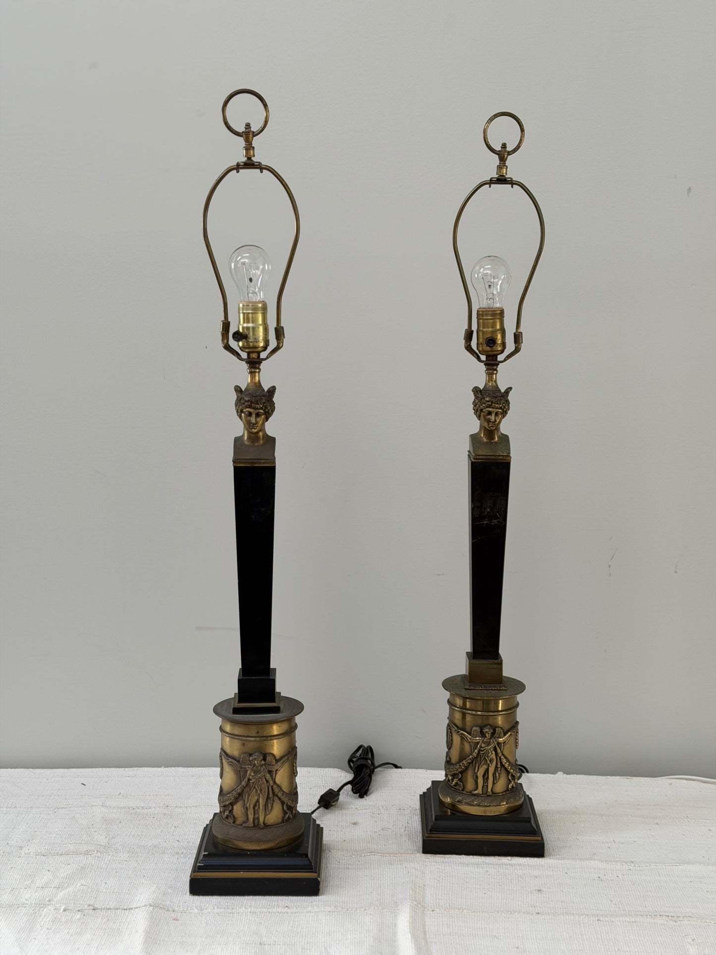 Pair of Neoclassical Brass and Black Table Lamps